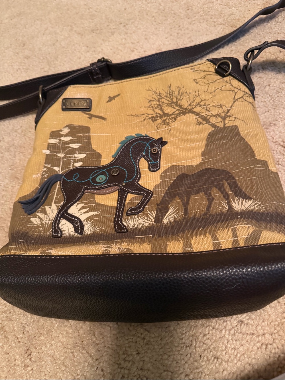 Chala Tan Crossbody Bag with Black Trim and Teal Horse Accent